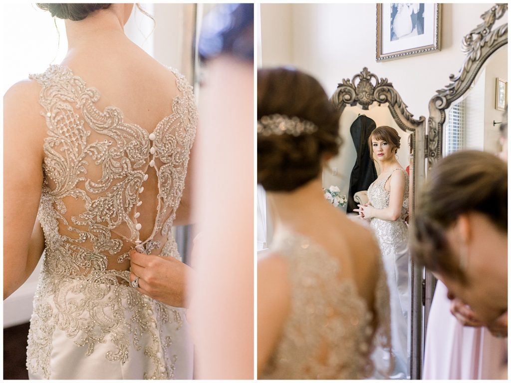 Bride sees reflection as she gets into her wedding dress