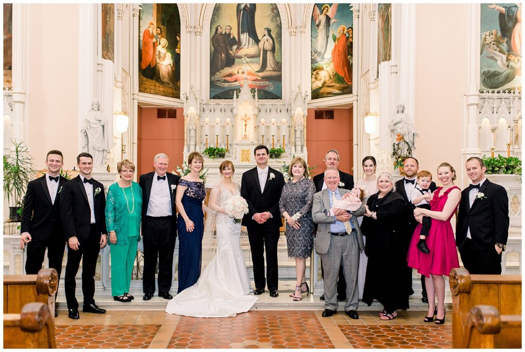 Large family photo of both the bride and groom's family at the Holy Cross Immaculata Church in Cincinnati, Ohio